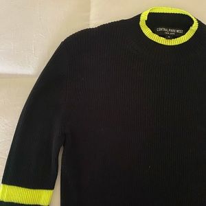Black sweater with neon yellow accents